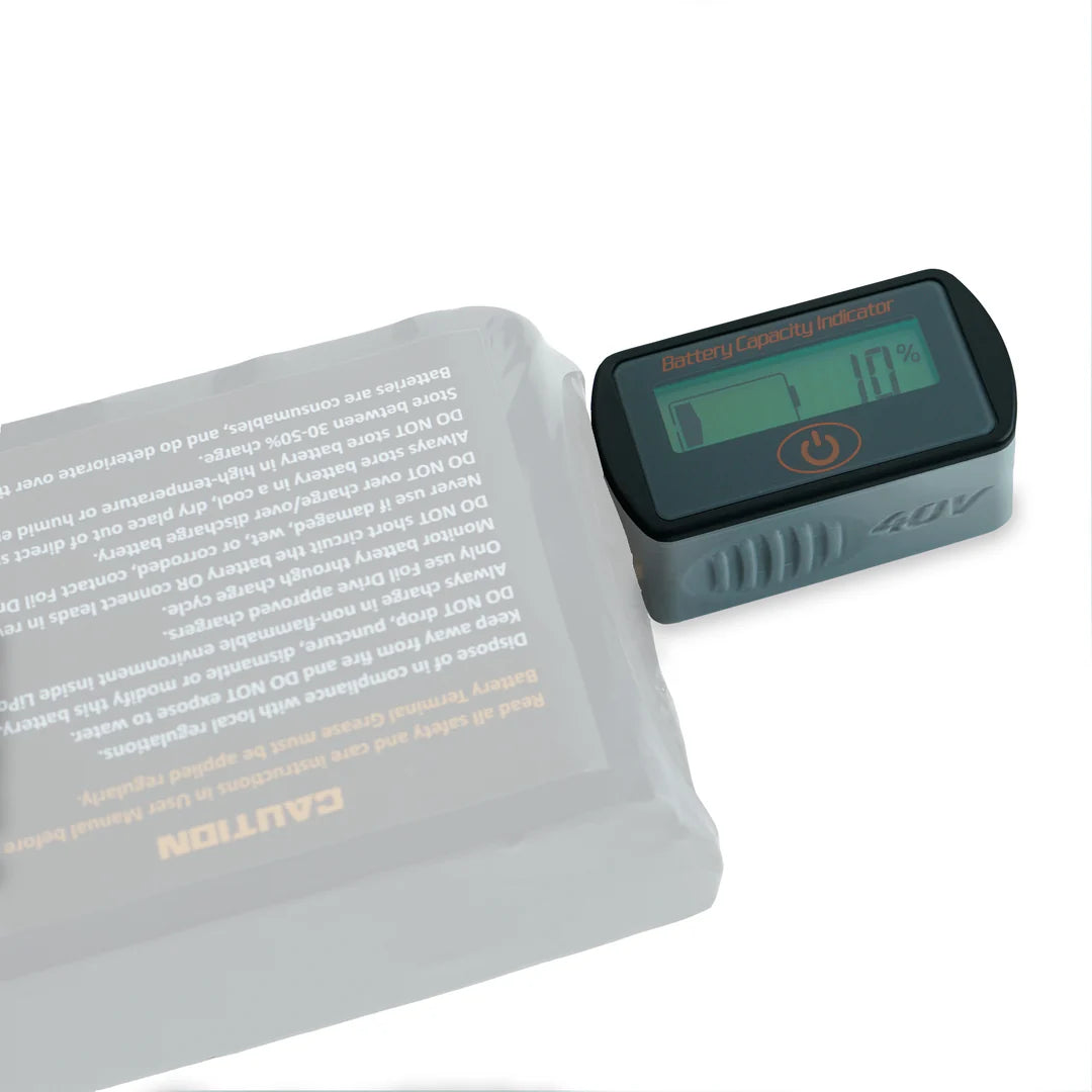 The Foil Drive Inline Battery Checker is connected to the side of the battery.